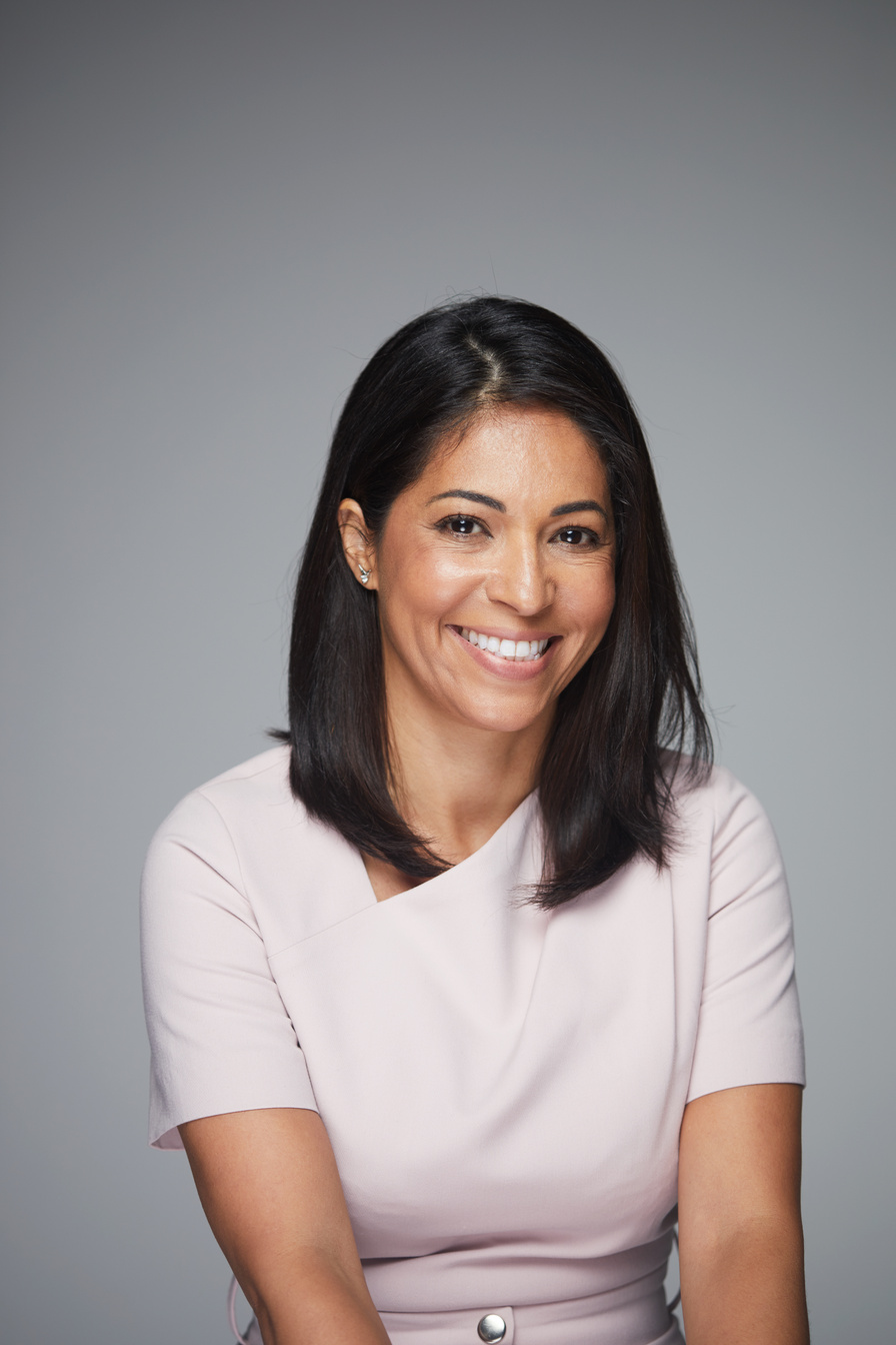 Studio headshot of beautiful Brazilian woman.